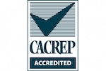 CACREP Accredited logo featuring a large blue check mark above the words “CACREP ACCREDITED” in bold letters, set against a striped background within a rectangular border.