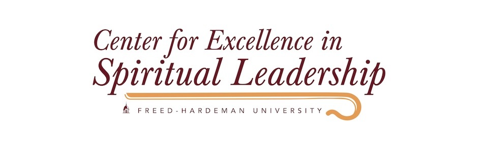 Text logo reading Center for Excellence in Spiritual Leadership with Freed-Hardeman University below, separated by a gold underline and a small building icon on the left.