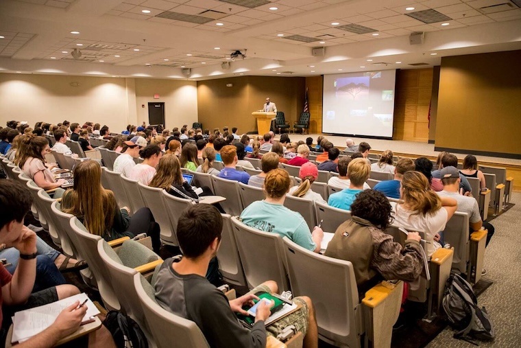 Students listen during a class held in Ayers