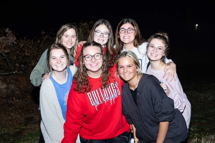 group of female students outside at night