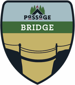 Shield-shaped logo with the word PASSAGE above an illustrated rope bridge spanning a gap, pine trees and a small church in the background, and the word BRIDGE in bold white letters across the center.