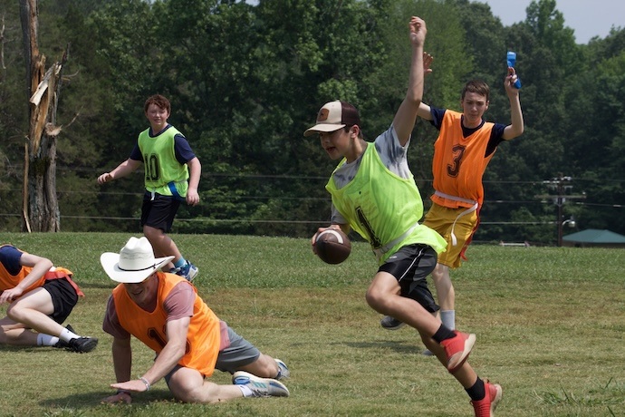 A group playing a game of flag football