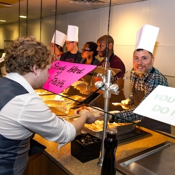faculty serving students breakfast
