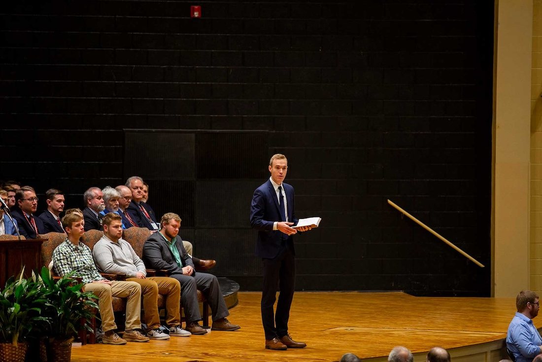 The speaker addresses the crowd from the main stage during the annual lectureships