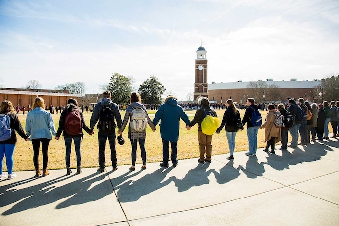 Students join in the commons to pray