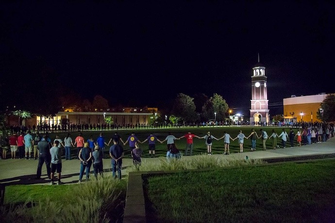 Students join in the commons to pray at night