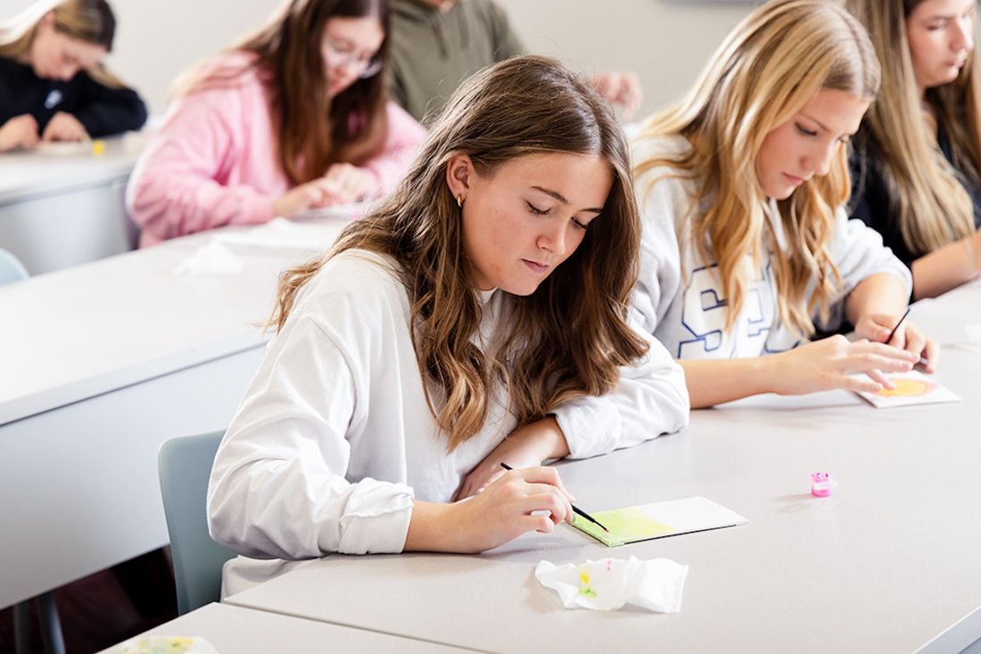 students taking notes in class
