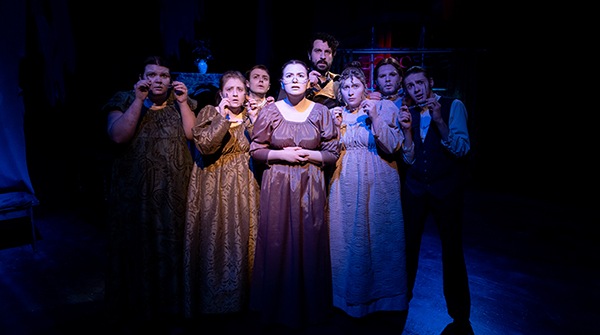 A group of students on stage during a theatre performance