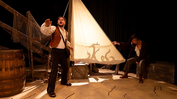 Two students on stage during a theatre performance