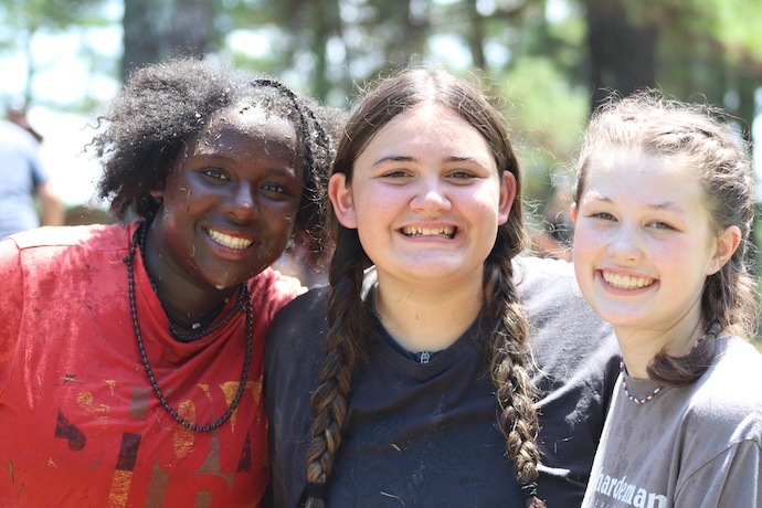 Three girls smiling for the camera